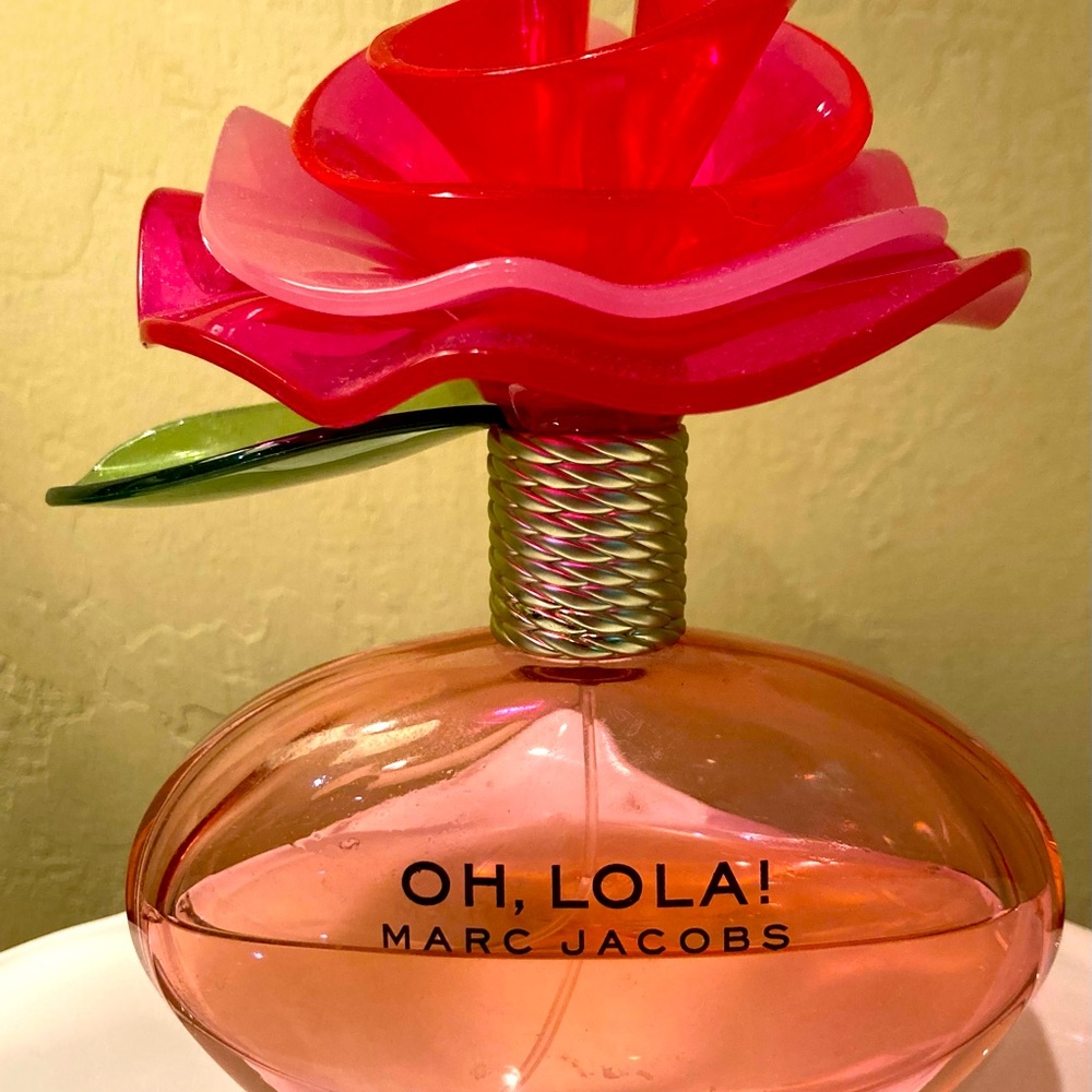 Marc Jacobs “Oh Lola” 3.4 oz perfume. Bottle 1/2 full. No box.